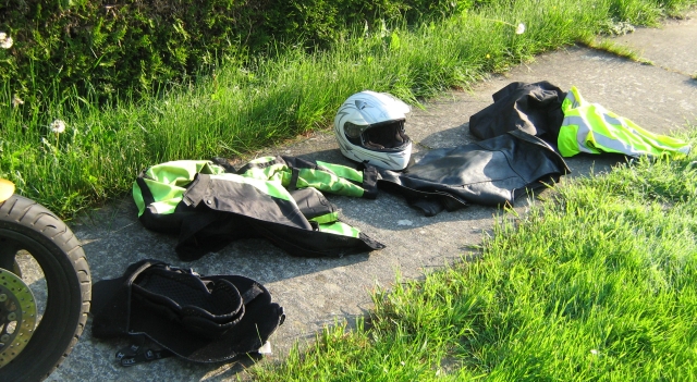 my motorcycle clothing on the concrete footpath at the campsite in bastogne, drying out in the sun